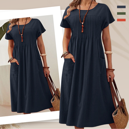 Női rakott ruha rövid ujjal és zsebekkel