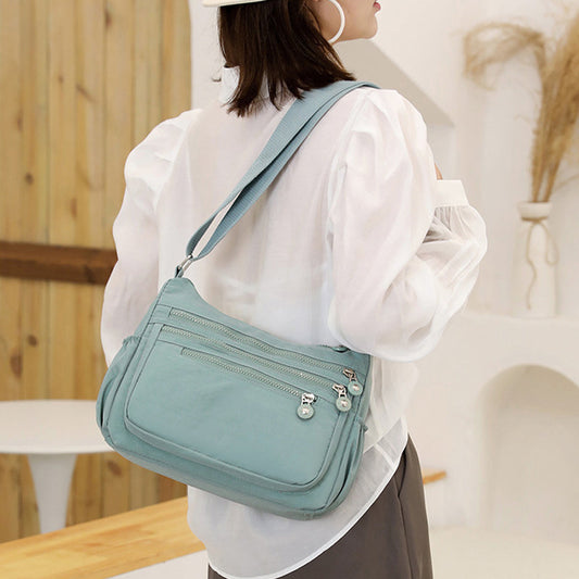 🎒 Könnyű többzsebű nylon válltáska
